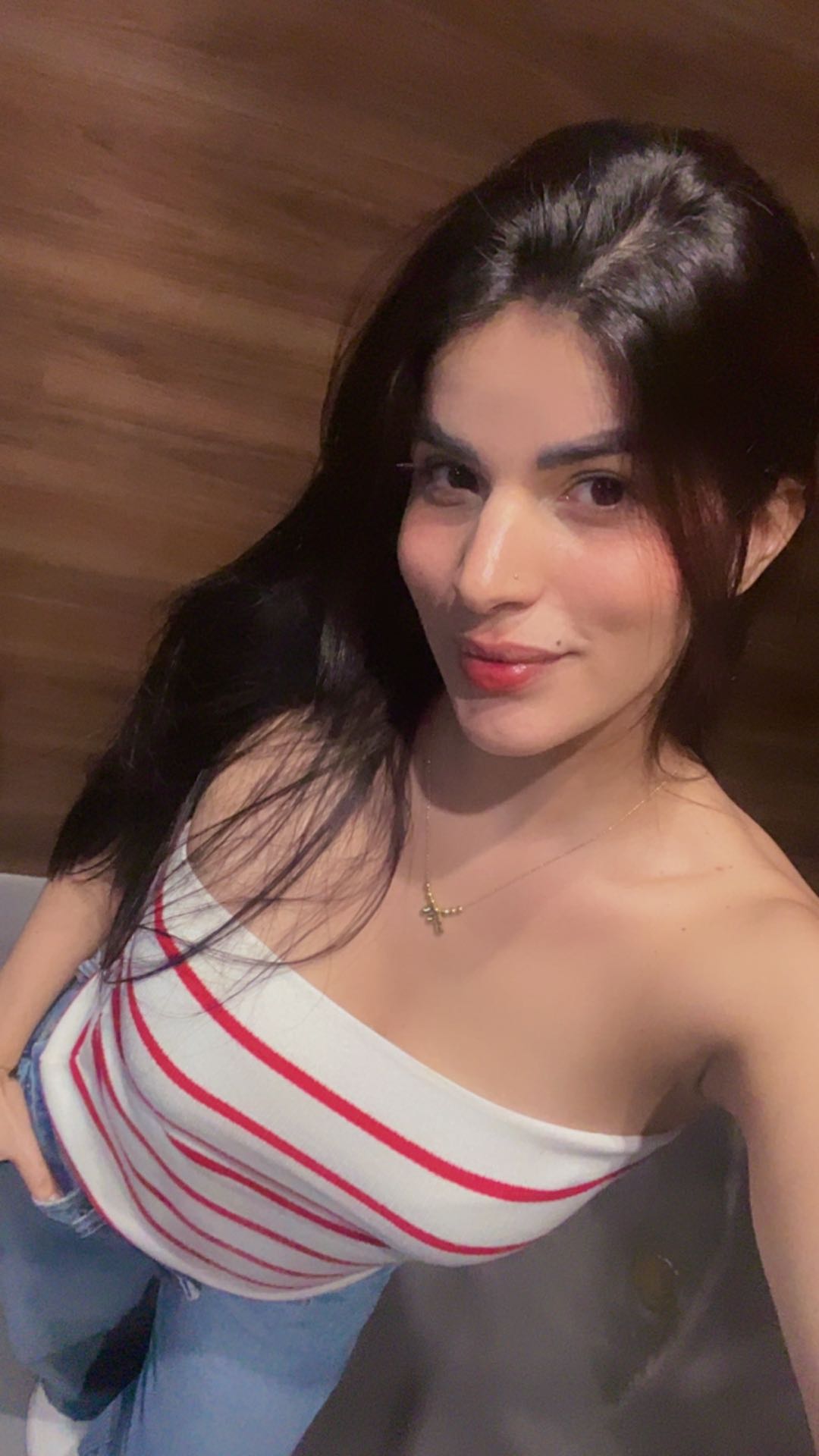 Woman with dark hair in a striped top